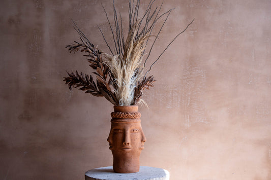 Five Faces Clay Pot